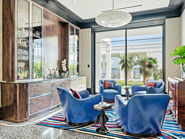 bar with decorative light fixtures and crown molding