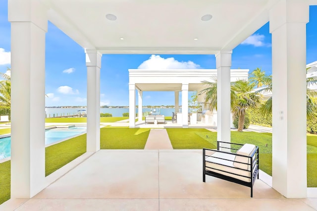 view of patio with an outdoor hangout area and a water view