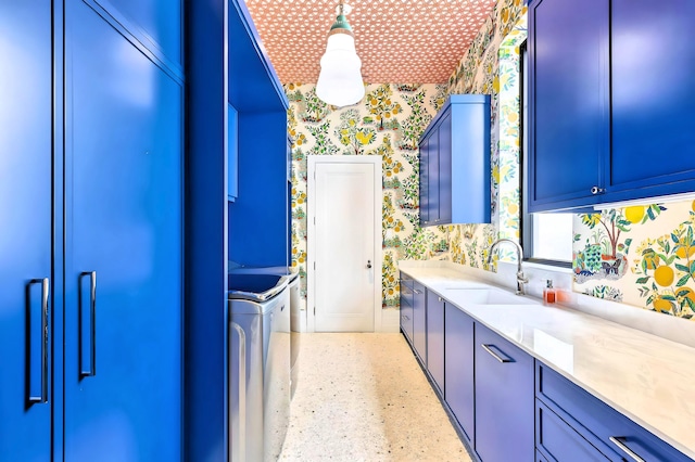 kitchen featuring blue cabinets and sink