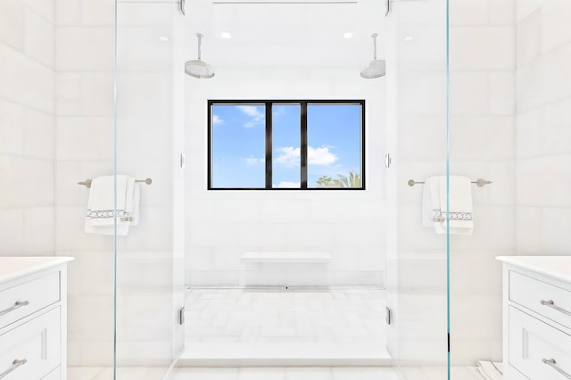 bathroom featuring vanity and an enclosed shower