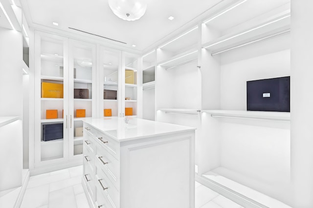 walk in closet featuring light tile patterned floors