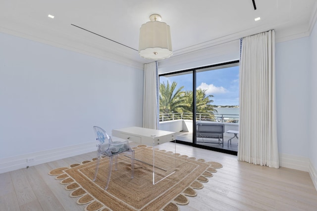 unfurnished dining area with crown molding and light hardwood / wood-style floors