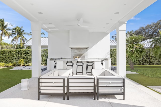 view of patio with an outdoor living space and ceiling fan