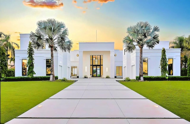 view of front of house with a yard