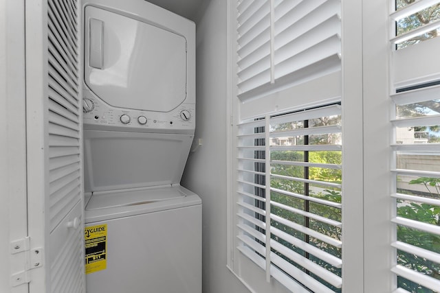 clothes washing area with stacked washer / drying machine