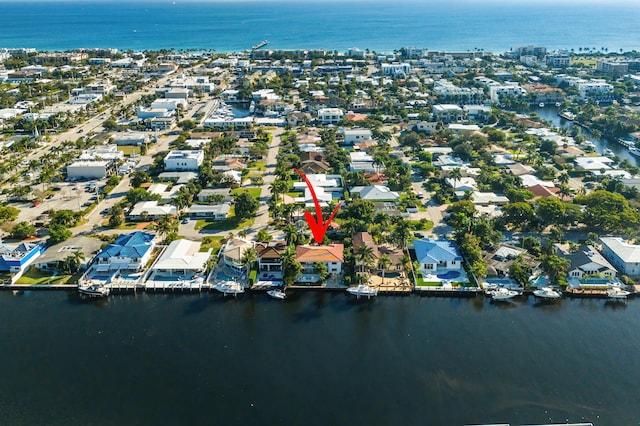 bird's eye view featuring a water view and a residential view