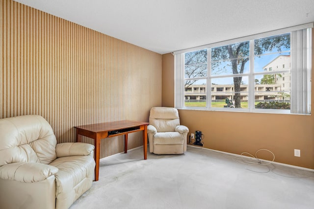 living area with carpet flooring