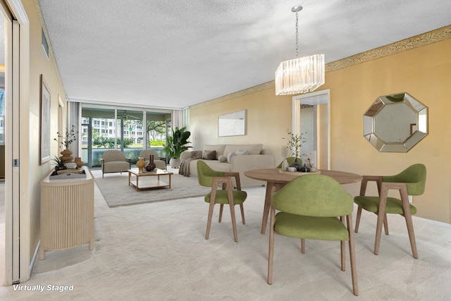 dining space featuring floor to ceiling windows, light colored carpet, a textured ceiling, and an inviting chandelier