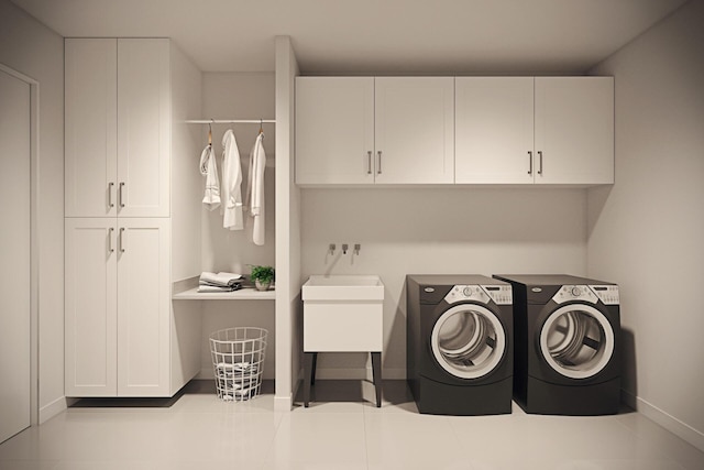 washroom with separate washer and dryer and cabinets