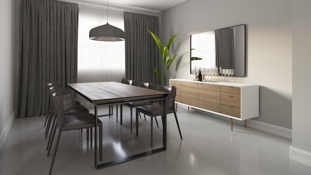 dining room with a wealth of natural light and light tile patterned flooring