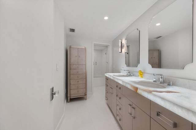 bathroom with tile patterned flooring and vanity