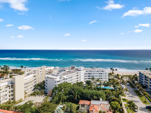 aerial view with a water view and a view of the beach