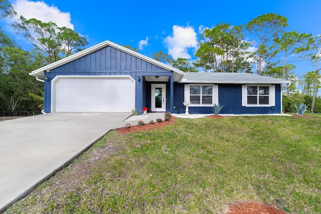 single story home featuring a garage and a front lawn