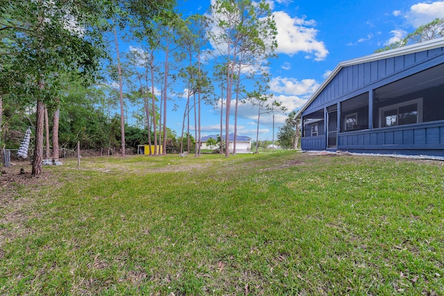 view of yard with a sunroom