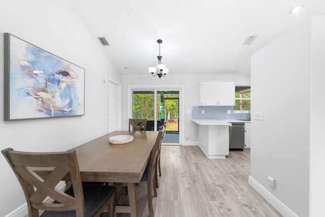 dining room featuring a chandelier and light hardwood / wood-style floors