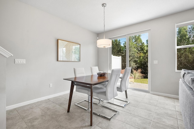 dining space with plenty of natural light and light tile patterned flooring