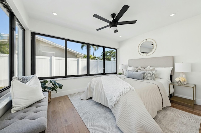 bedroom featuring light wood-type flooring and ceiling fan