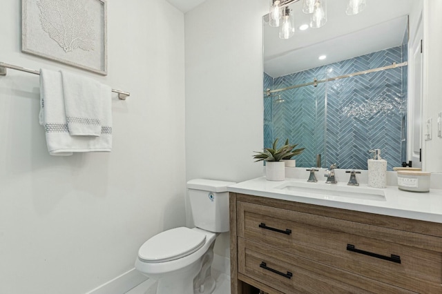 bathroom with vanity, toilet, and an enclosed shower