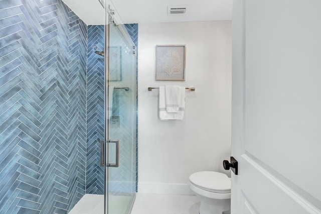 bathroom with toilet and an enclosed shower