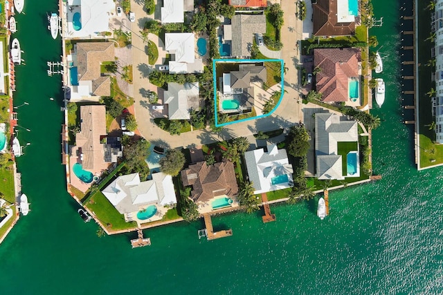 birds eye view of property featuring a water view