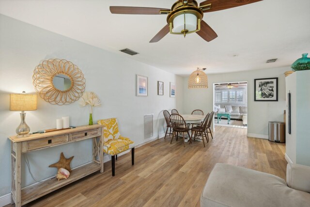 dining space featuring light wood-type flooring