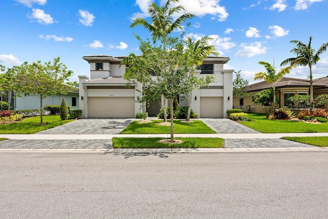 view of front facade with a garage and a front yard