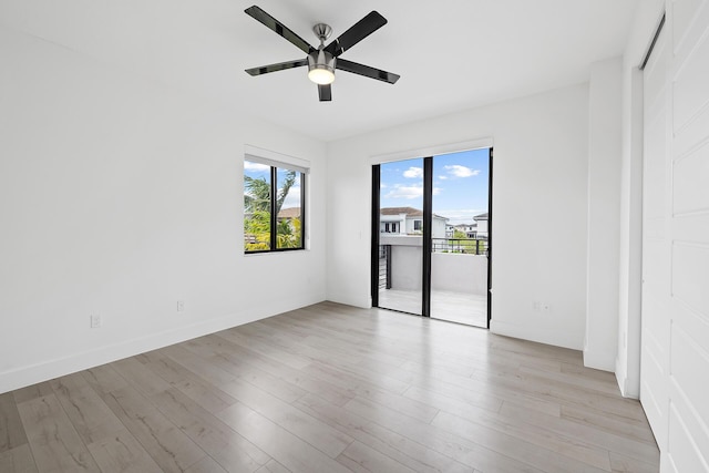 empty room with light hardwood / wood-style floors and ceiling fan