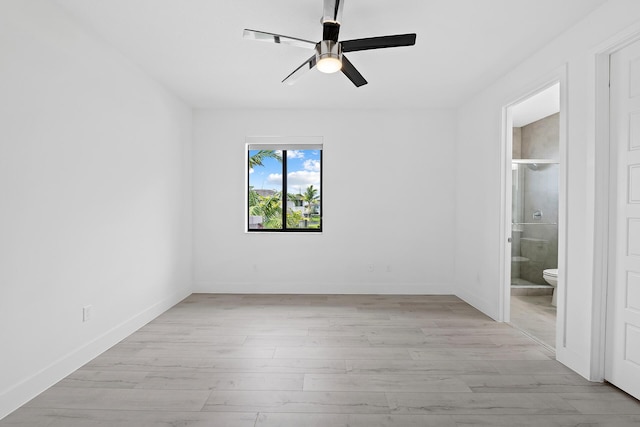 unfurnished room featuring ceiling fan and light hardwood / wood-style flooring