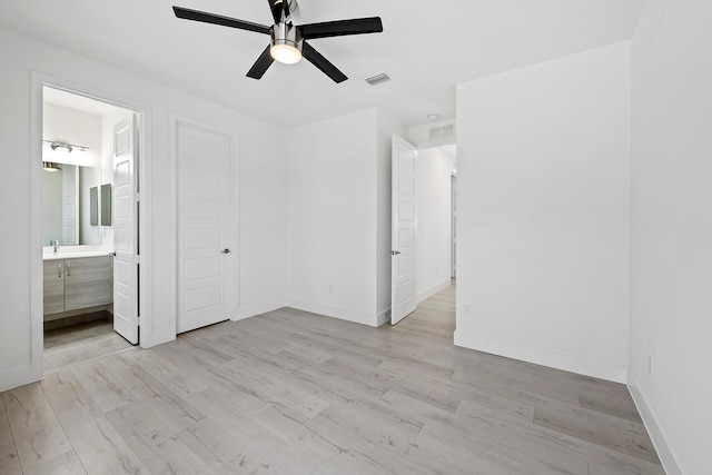 unfurnished bedroom featuring ensuite bath, ceiling fan, a closet, and light hardwood / wood-style floors