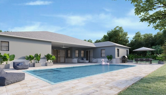 view of swimming pool with area for grilling, a patio, and exterior kitchen