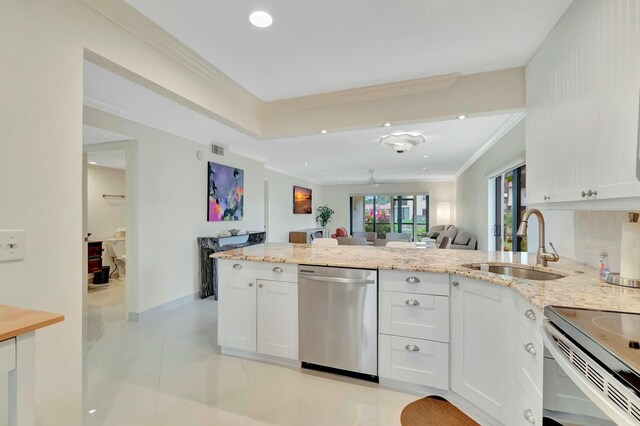 dining area with sink, light tile patterned floors, and crown molding