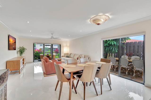 dining area with ceiling fan, crown molding, and a healthy amount of sunlight