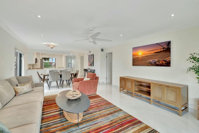 living room featuring ceiling fan, light tile patterned floors, and ornamental molding