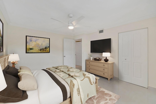 bedroom featuring a closet, ceiling fan, and ornamental molding