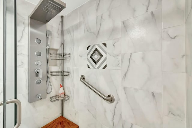 bathroom with a tile shower