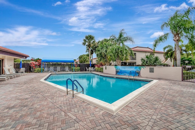 view of swimming pool featuring a patio