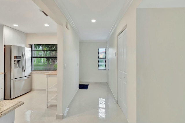 hallway featuring crown molding