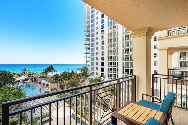 balcony featuring a water view