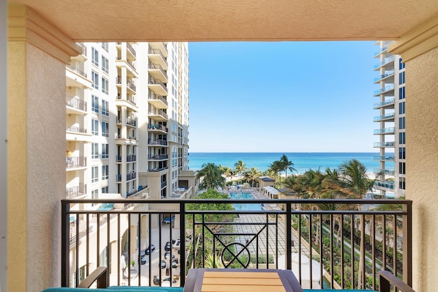 balcony featuring a water view