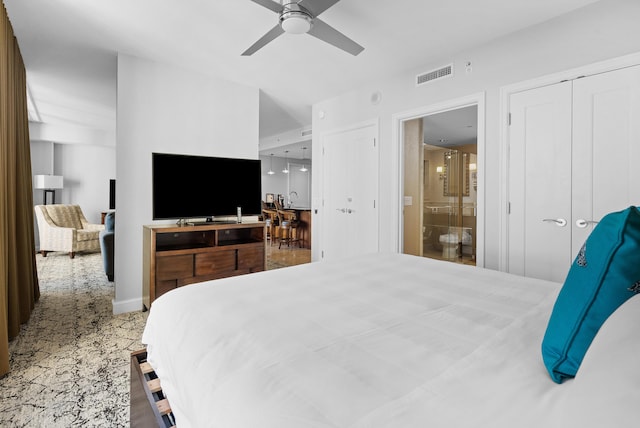 bedroom featuring ensuite bathroom and ceiling fan