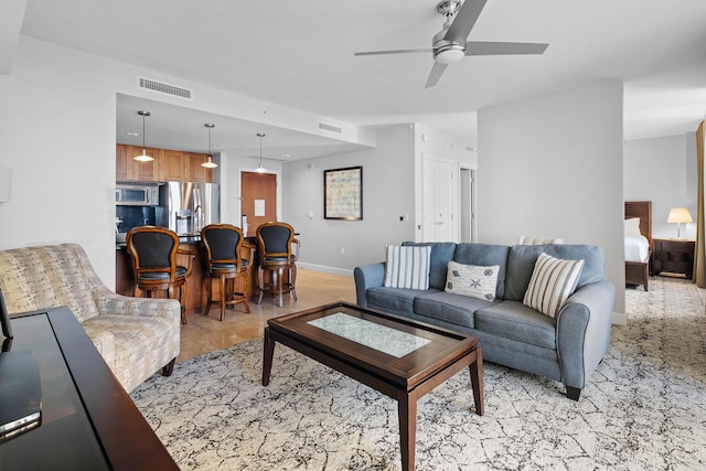 living room featuring ceiling fan