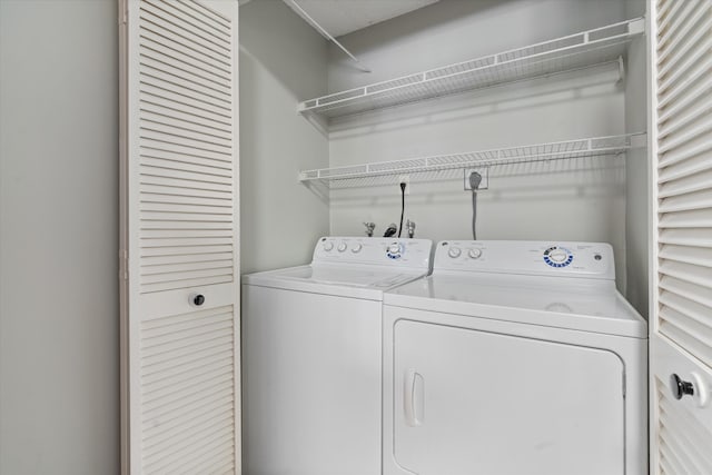 washroom featuring independent washer and dryer