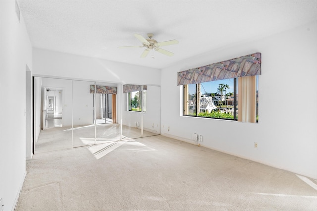 interior space with ceiling fan