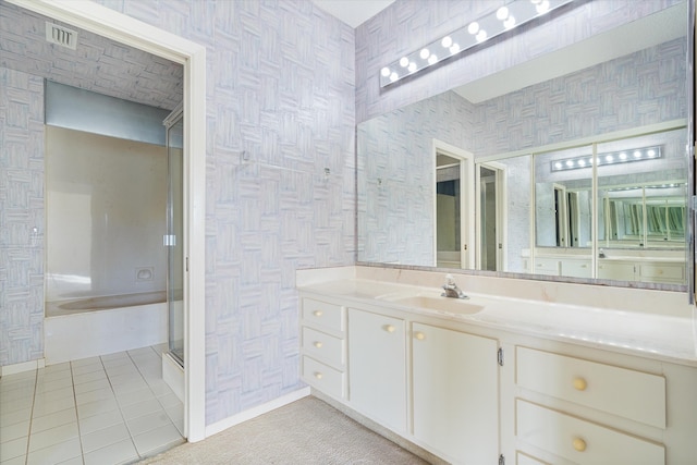 bathroom featuring tile patterned floors, vanity, and plus walk in shower