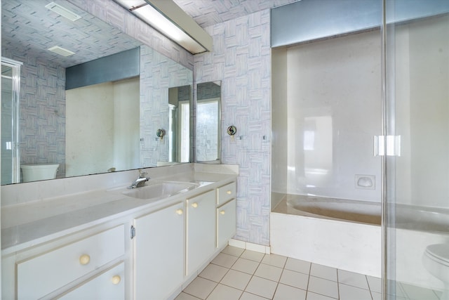 full bathroom featuring tile patterned floors, vanity, toilet, and washtub / shower combination