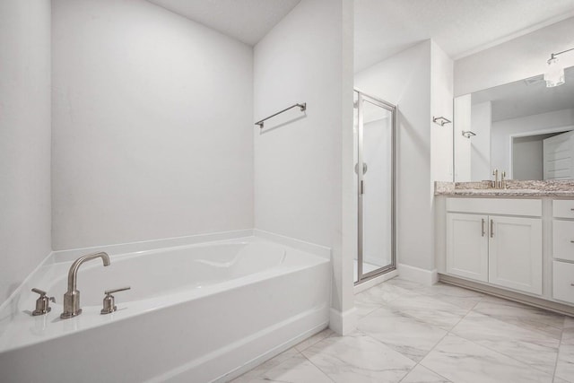 bathroom featuring plus walk in shower, vanity, and a textured ceiling