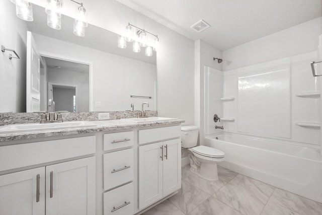 full bathroom with shower / bathing tub combination, vanity, toilet, and a textured ceiling