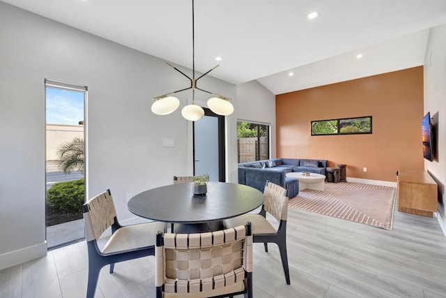 dining area with a chandelier and light hardwood / wood-style floors