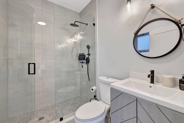 bathroom with vanity, toilet, and an enclosed shower