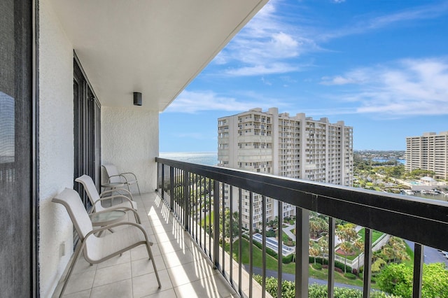 balcony featuring a water view